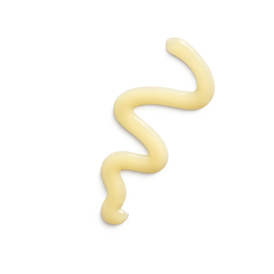 Creamy, yellow gel from Eminence Mango Exfoliating Enzyme Masque, highlighting its smooth texture.